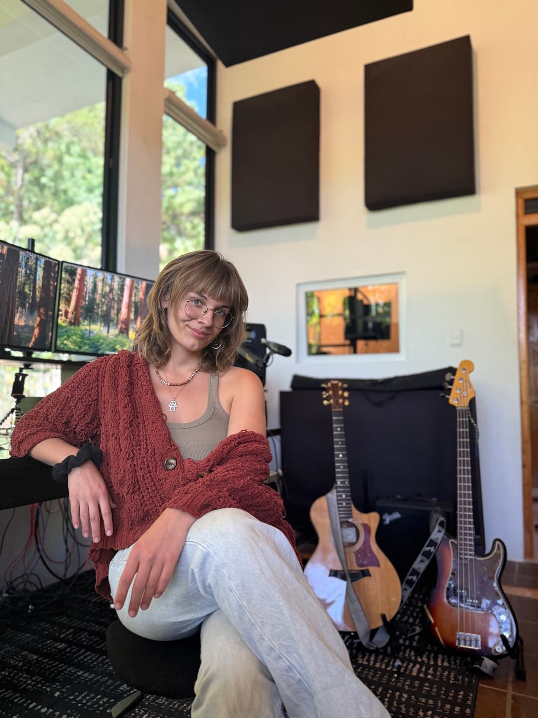 Flow playing guitar on mossy river rocks